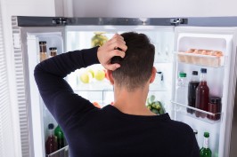 Man looking into fridge